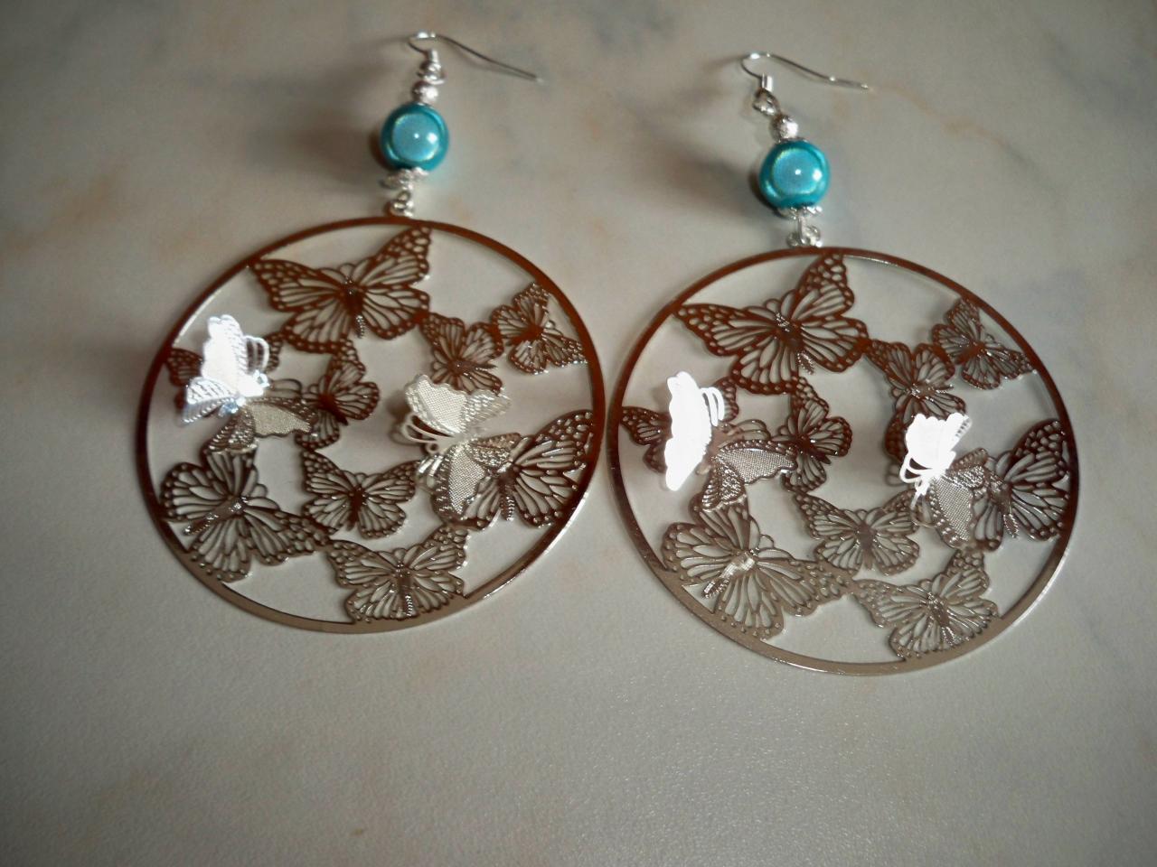 Boucles d'oreilles estampe papillons en relief