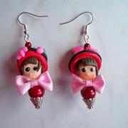 Boucles d'oreilles tête petite fille rouge